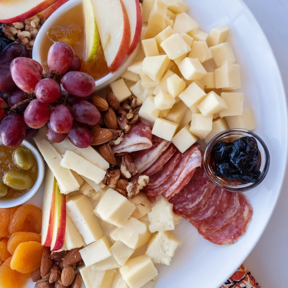 A Moonlight Picnic Board featuring various cheeses, fruits, and meats, ready for elegant enjoyment.
