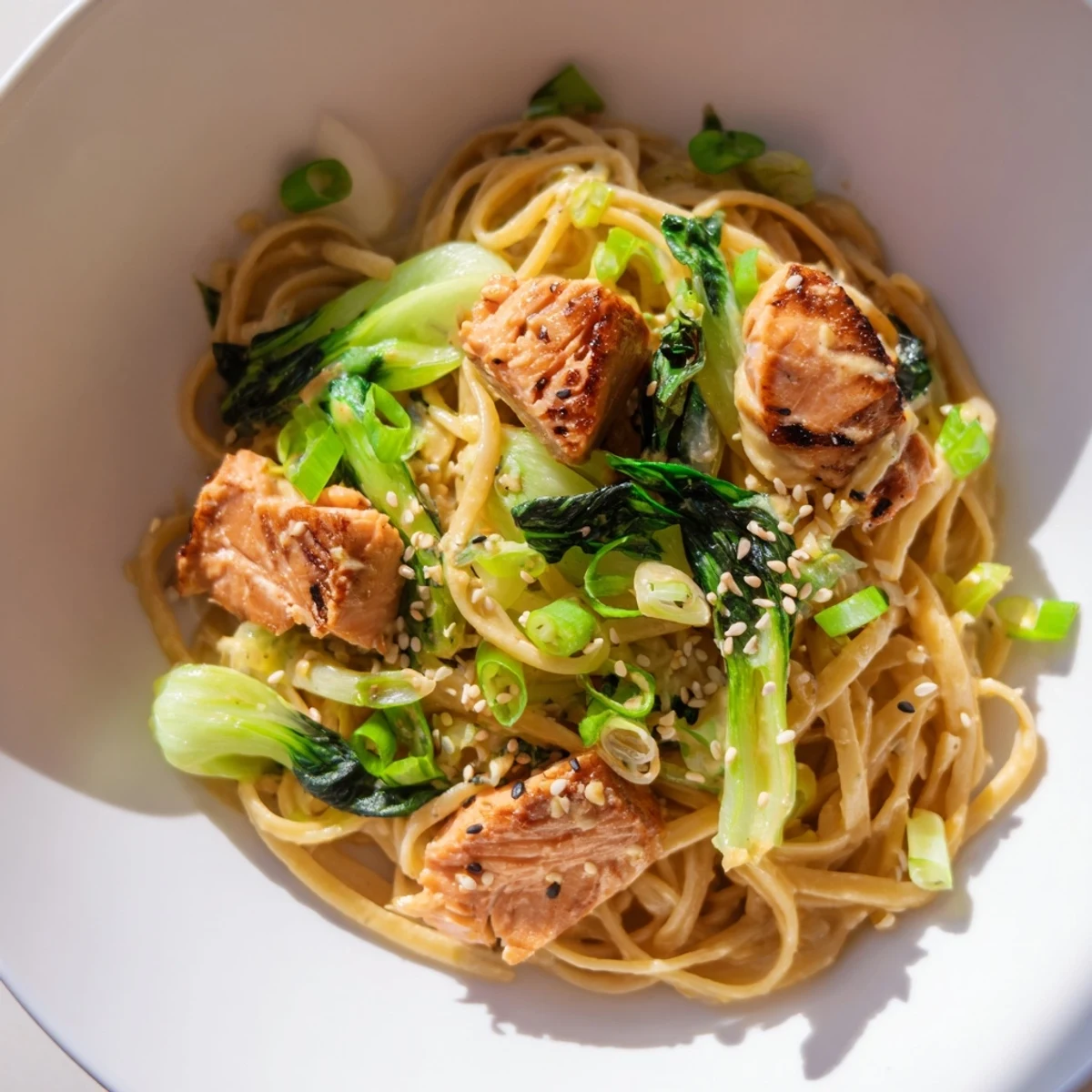 Delicious Miso Butter Salmon Pasta, combining Japanese flavors with Italian pasta, garnished with scallions.
