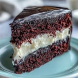 Betty Boop Cake with shiny black fondant hair and bright white eyes is served as a cartoon-themed dessert.