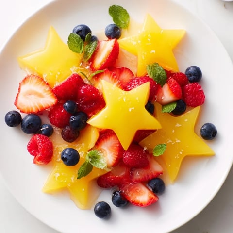 Fresh starfruit and berry platter, beautifully arranged, makes a colorful, healthy snack for any occasion.