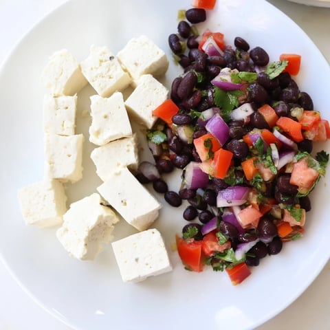 Fresh Pepper Jack cheese cubes alongside vibrant black bean salsa, perfect for any savory bites appetizer.