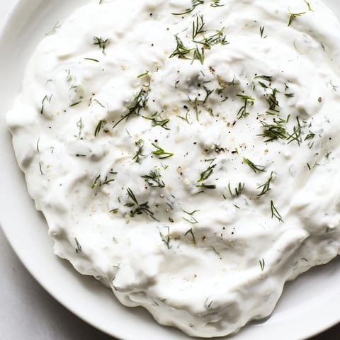 Creamy Greek yogurt ranch dip with fresh herbs, ready for dipping crisp vegetables.