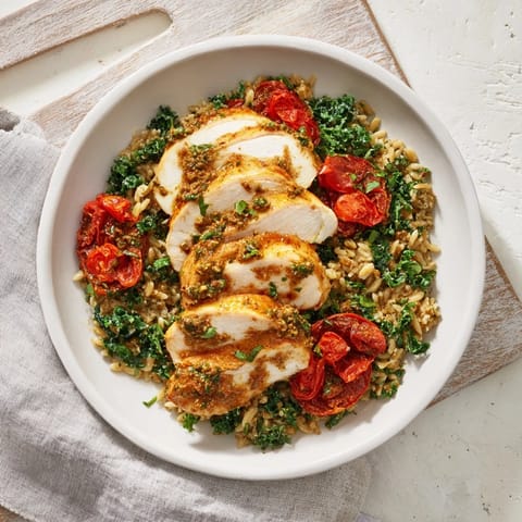 Golden-brown chicken breasts nestled in creamy Marry Me Chicken Orzo; a comforting, Italian-inspired dinner.