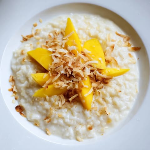 Golden, slightly browned toasted coconut on top of a luscious, creamy toasted coconut rice pudding.