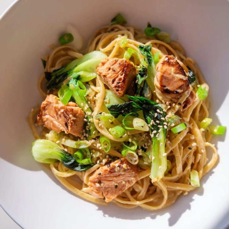 Delicious Miso Butter Salmon Pasta, combining Japanese flavors with Italian pasta, garnished with scallions.